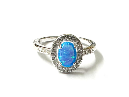 A Blue Opal And White Cubic Zirconia Ring
