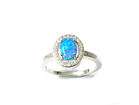 A Blue Opal And White Cubic Zirconia Ring