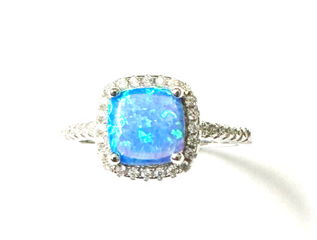 A Blue Opal And White Cubic Zirconia Ring