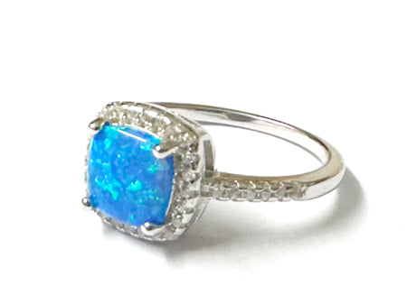 A Blue Opal And White Cubic Zirconia Ring
