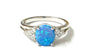 A Blue Opal And White Cubic Zirconia Ring