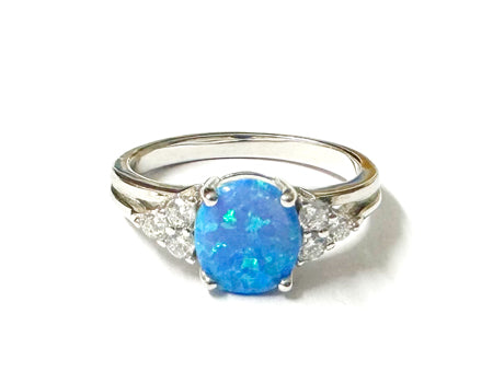 A Blue Opal And White Cubic Zirconia Ring