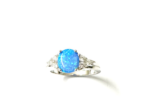 A Blue Opal And White Cubic Zirconia Ring