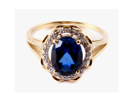 A 9ct Yellow Gold Sapphire Cz Ring.